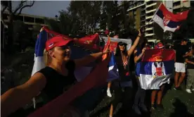  ?? Photograph: James Ross/AAP ?? Novak Djokovic supporters gather outside Melbourne’s Park hotel, where the tennis star was being detained on Thursday after having his Australian visa cancelled.