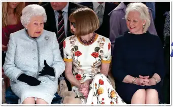  ?? ?? LoyaL: Angela with her Royal Victorian Order medal. Above, with the Queen and Anna Wintour