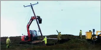  ??  ?? North pole: Workers attempt to fix power lines in Shetland which had been brought down, above. Left: Drivers had a lucky escape after a tree fell on the A91 in Fife