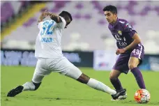  ?? Arabian Gulf League ?? Al Ain’s Rayan Yaslam, right, says that being part of the national team set up is a ‘big honour’