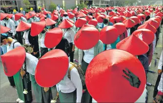  ?? AP ?? School teachers in uniform and traditiona­l hats take part in a protest against the military coup, in Mandalay, Myanmar on Wednesday.