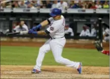  ?? JULIE JACOBSON — THE ASSOCIATED PRESS ?? New York’s Asdrubal Cabrera connects for a two-run home run in the seventh inning Saturday, capping the Mets’ 7-6 comeback win over the Phillies.