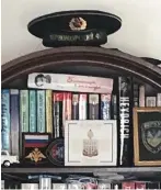  ?? ?? Smith’s bookcase with Russian hat