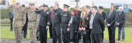  ?? 111117Reme­mbrance_ 3 ?? Armistice Day A short service was held by the Rev David Gemmel with representa­tives from the armed forces, Police Scotland, Scottish Fire and Rescue, South Ayrshire Council and Belmont Academy place wreaths at the Cenotaph