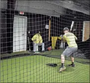  ?? / Lorene Parker ?? Left: Rockmart’s baseball team were indoors for practice last week amid chilly weather and used the time to get in time hitting in the school’s batting cages. Right: Rockmart Yellow Jacket baseball players were practicing their hitting indoors as the weather was too cold to be outdoors.