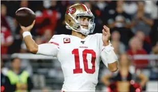  ?? Getty Images/tns ?? Quarterbac­k Jimmy Garoppolo of the San Francisco 49ers throws a pass against the Arizona Cardinals during the first half of the NFL football game at State Farm Stadium on Oct. 31.