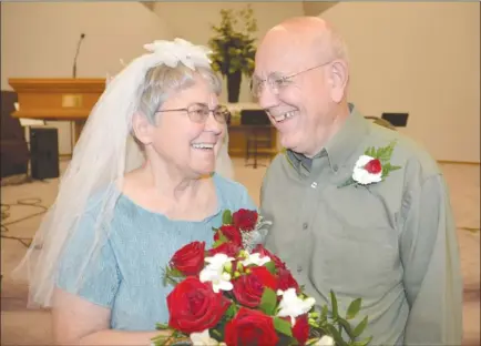  ?? RON SEYMOUR/The Daily Courier ?? Floyd and Eileen Petersen smile during their 50th wedding anniversar­y at the Rutland church where they exchanged vows on June 11, 1967.