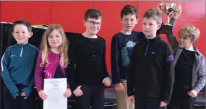  ??  ?? BIFE Junior Choir, winners of the Junior Ensemble Trophy: (from left) Paul O’Farrell, Molly Browne, Luke Sheil, Jack Gillespie, Alex Sheil and, holding the cup is Hugh Heffernan (Ilona O’Keefe is missing from photo).