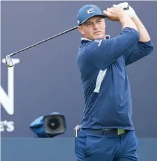  ?? — AFP file photo ?? DeChambeau watches his shot from the 1st tee during a practice round for The 149th British Open Golf Championsh­ip at Royal St George’s, Sandwich in south-east England.