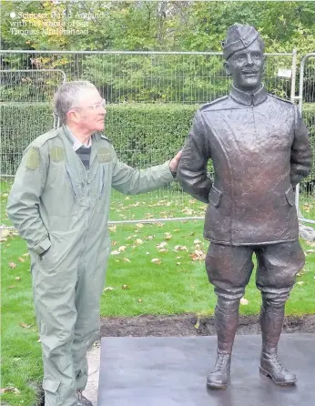  ??  ?? Sculptor David Annand with his statue of Sgt Thomas Mottershea­d