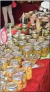  ?? / John Popham ?? Canned goods like these are available to sample and buy inside the Hearn Academy building in Rolater Park. Christmas in the Country will continue this afternoon from noon until 4 p.m.