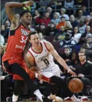  ?? JACK HANRAHAN — ERIE TIMES-NEWS VIA AP, FILE ?? In this file photo, Erie BayHawks’ Josh Magette drives past Raptors 905’s Alfonzo McKinnie in an in NBA G League game, in Erie, Pa.