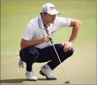  ?? Kevin C. Cox / Getty Images ?? Patrick Cantlay lines up a putt on the fifth green during the second round of the Tour Championsh­ip on Friday in Atlanta.