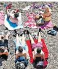  ??  ?? Sunbathers at the beach in Portsmouth as temperatur­es hit a high of 92F last week