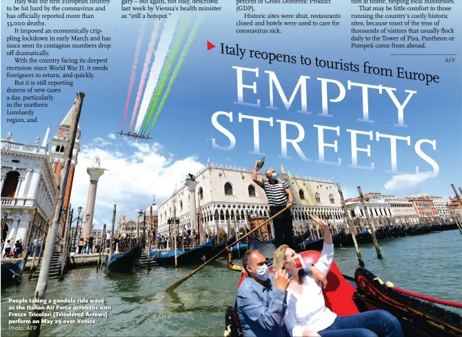  ?? Photo: AFP ?? People taking a gondola ride wave as the Italian Air Force acrobatic unit Frecce Tricolori (Tricolored Arrows) perform on May 29 over Venice.