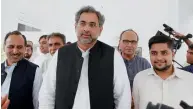  ?? AP ?? Premier-designate Shahid Khaqan Abbasi leaves with his aides after meeting with politician­s at Parliament house in Islamabad on Monday. —
