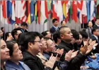  ??  ?? Audience members applaud at the closing ceremony of the Wuzhen conference on Friday.