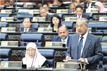  ??  ?? Dr Mahathir tabling the Constituti­on (Amendment) Bill 2019 for second reading in the Dewan Rakyat.
