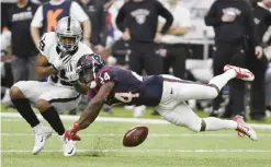  ??  ?? HOUSTON: Houston Texans cornerback Johnathan Joseph (24) breaks up a pass intended for Oakland Raiders wide receiver Amari Cooper (89) during the first half of an AFC Wild Card NFL game Saturday, in Houston. — AP