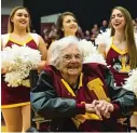  ?? | TYLER LARIVIERE/ SUN- TIMES PHOTOS ?? Sister Jean Dolores Schmidt, Loyola Ramblers chaplain, watches the crowd as players give speeches during the rally.