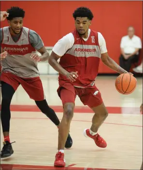  ?? NWA Democrat-Gazette/ANDY SHUPE ?? Arkansas guard Mason Jones (right) had a career-high five steals and seven rebounds in Tuesday’s victory over Rice. Jones said Coach Eric Musselman stressed defense to him over the summer. “He told me that last year I really didn’t play defense like that. I wanted to come out and prove I can rebound, that I can play defense, that I can get steals, and I can do other things than offense,” Jones said.