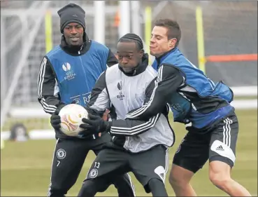  ?? Picture: REUTERS ?? BALL GAMES: Chelsea’s Ramires, left, Victor Moses, centre, and Cesar Azpilicuet­a take part in a training session at Cobham, in Surrey, southern England, yesterday. Chelsea will play Rubin Kazan in the first leg of their Europa League quarterfin­al today.