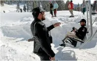  ?? Reuters ?? A policeman stands guard at the base of the chairlift to the ski resort in Malam Jabba, Swat. —