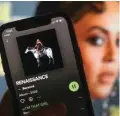  ?? ?? Beyonce’s new album ‘Renaissanc­e’ is seen on a music streaming app on a smartphone with a picture of the singer in the background. — AFP