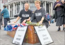  ?? PHOTO / FILE ?? Patient Voice Aotearoa members stand alongside a coffin adorned with messages during a protest by the action group at Parliament in January 2020.