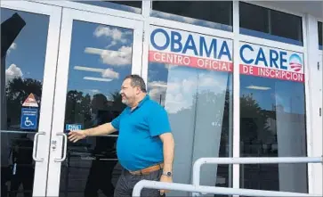  ?? Joe Raedle Getty Images ?? OBAMACARE has led to historic gains in health coverage over the last three years, as some 20 million previously uninsured Americans gained health insurance. Above, health insurance sign-ups in Miami in 2015.