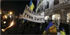  ?? BLOOMBERG ?? Anti-war protestors demanding Russian banks be cut off from Swift