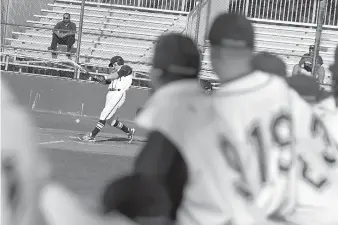  ?? Staff photo by Jerry Habraken ?? Texas A&M University­Texarkana’s Chase Beebe connects to hit a grounder during their game against Texas Wesleyan University on Wednesday at George Dobson Field in Texarkana.