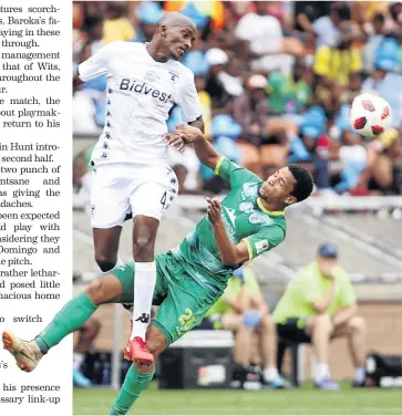  ?? / ANTONIO MUCHAVE ?? Bidvest Wits player Lehlohonol­o Nonyane fights for the ball with Baroka’s Jemondre Dickens during their Telkom Knockout match at Peter Mokaba Stadium in Polokwane yesterday.