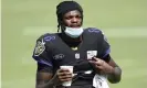  ??  ?? The Baltimore Ravens quarterbac­k Lamar Jackson has contracted Covid twice in the past 12 months. Photograph: Gail