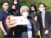  ??  ?? State Sen. Will Haskell, D-New Canaan, far right, poses for a selfie with, from left, Mike Cerulli, Daira Rivera, Michael Hernández, Darius Williams and Eloisa Melendez.