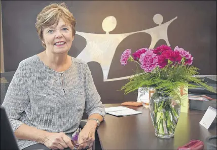  ?? HARRY SULLIVAN   TRURO NEWS ?? After 35 years as executive director of Big Brothers Big Sisters of Colchester, Michelle Misener has decided to retire. The carnations on her desk were given to her by agency volunteers and both current and former matches.