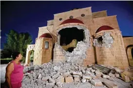  ?? Petros Giannakour­is / Associated Press ?? An earthquake shook resorts in Greece and Turkey on Friday, damaging the facade of the Agios Nikolaos church on the Greek island of Kos. Two tourists were crushed when a building collapsed on a popular bar in Kos.