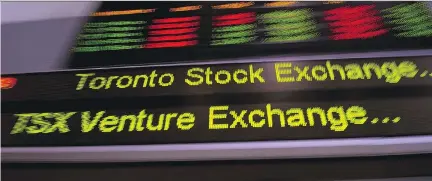  ?? FRANK GUNN/THE CANADIAN PRESS, FILES ?? Canada is looking attractive for investors as the outlook for the global economy remains weak or uneven in Europe, Asia and the U.S. The S&P/TSX composite index posted a total return of 15 per cent this year, putting it on track for its best year since...