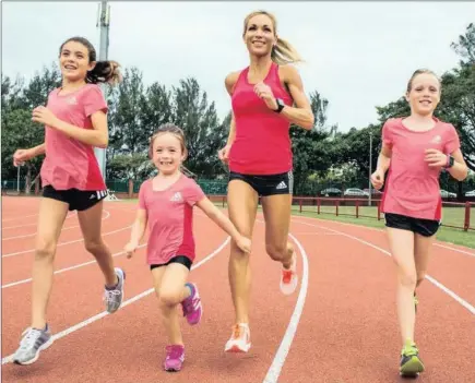  ??  ?? IRON MOM: Durban’s Jenna Challenor, the first South African woman home in last week’s Two Ocean’s ultra marathon, training with daughters (from left) Nicolette (12), Tao (4) and Ryleekai (10). MATSHELANE MAMABOLO