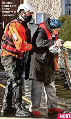  ??  ?? Helping hand: Care home resident is evacuated