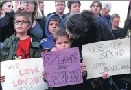  ?? ANDY BUCHANAN / AFP ?? People in Carlisle, England, show solidarity on Sunday with victims of Saturday’s London terror attack. They gathered outside the County Hotel, where British Labour Party leader Jeremy Corbyn spoke about the attack that killed seven.