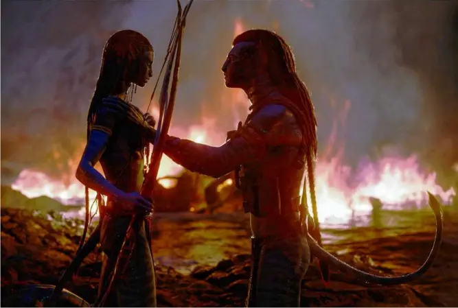  ?? 20TH CENTURY STUDIOS VIA AP ?? Zoe Saldaña as Neytiri (left) and Sam Worthingto­n as Jake Sully in “Avatar: The Way of Water.”