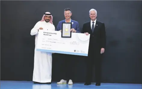  ?? COURTESY OF DESERT CONTROL ?? OLE KRISTIAN SIVERTSEN (CENTER), CEO OF DESERT CONTROL, flanked by Dr. Badr Al Badr, CEO of MISK Foundation (left) and Jonathan Ortmans, founder and president Global Entreprene­urship Network, accepts a $50,000 cash reward, the top prize in the Sustainabi­lity and Environmen­t category at the Entreprene­urship World Cup Global Finals held in Riyadh, Saudi Arabia, March 9-12.