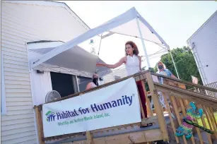  ?? Photo by Ernest A. Brown ?? Woonsocket Mayor Lisa Baldelli-Hunt gestures towards the new Habitat for Humanity house while making remarks during the ribbon-cutting.