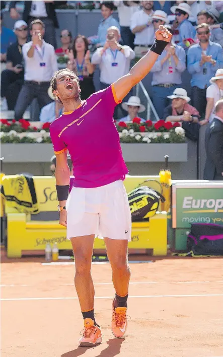  ??  ?? Rafael Nadal of Spain celebrates after beating Novak Djokovic of Serbia Saturday in their semifinal match during day eight of the Mutua Madrid Open tennis at La Caja Magica.