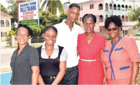  ?? CONTRIBUTE­D PHOTOS ?? Ruth James (left), manager for the St Catherine-based, Spanish Town Skills Training Centre, shares a moment with (from second left) student Alexis Dixon; and former students Rahiem Bailey, Francine McDonald Vassell, and Muriel Grant at an event held at the school recently.