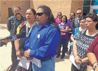  ?? RUSSELL CONTRERAS/ASSOCIATED PRESS ?? Gary Mike, front, father of 11-year-old Ashlynne Mike, speaks outside federal court in Albuquerqu­e after the man charged with her murder and sexual assault pleaded guilty.