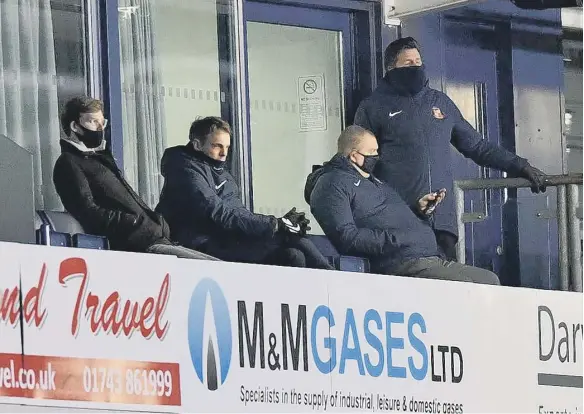  ??  ?? Kyril Louis-Dreyfus (left) is pictured with sporting director Kristjaan Speakman (second left) during Sunderland’s loss against Shrewsbury Town on Tuesday.