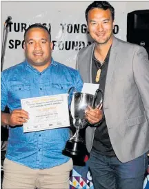  ??  ?? Tau Thompson of the Southern Tribes Tu¯wharetoa Brazilian Jiujitsu Team was presented with the Sportspers­on of the Year award by Te Takinga New of the Tu¯rangi-Tongariro Community Board. His club was also named Club of the Year.