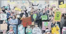  ??  ?? LIVE SIMPLY Schoolpupi­ls were among the protesters in Portsmouth last Friday asking the government to do more to help the environmen­t.